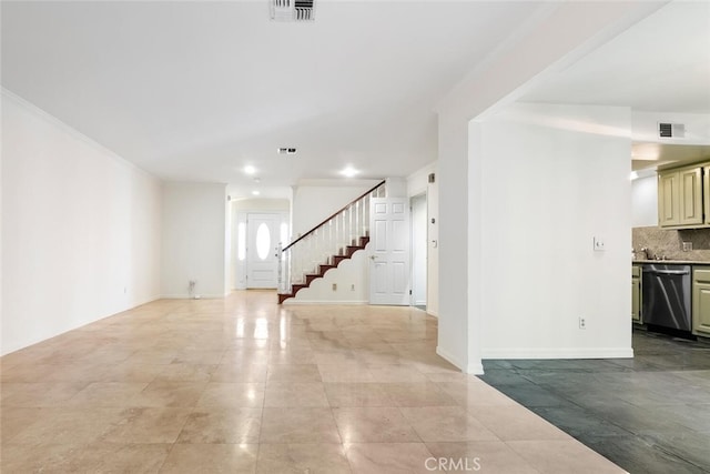 tiled empty room with crown molding