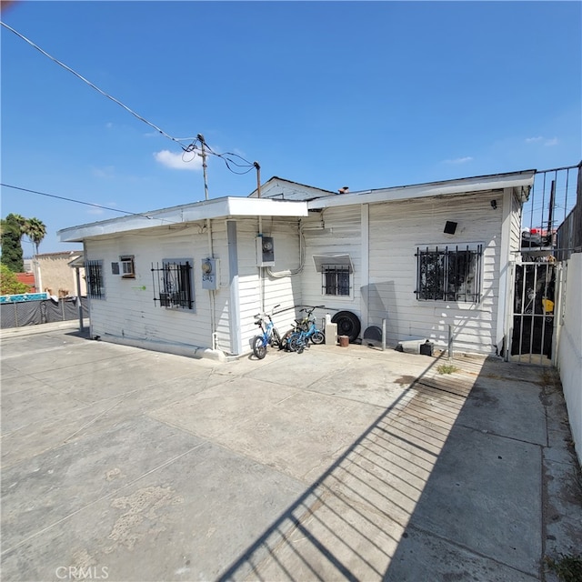 back of house with a patio