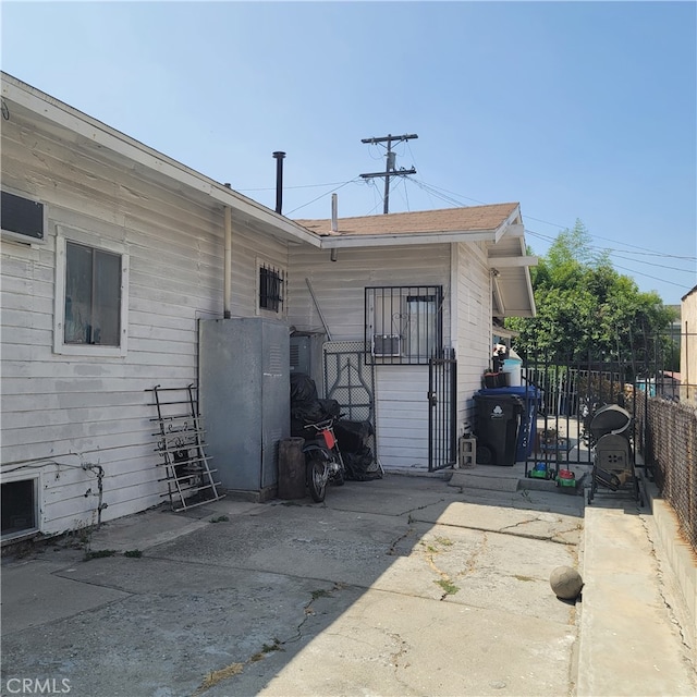 back of property with a patio