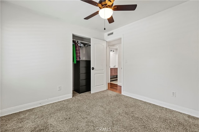 unfurnished bedroom featuring a closet, carpet, and ceiling fan