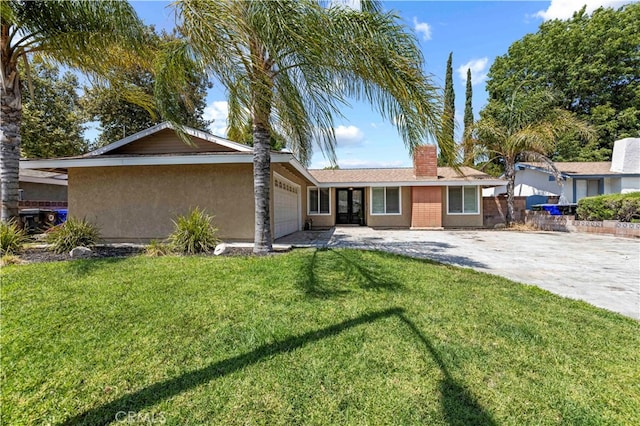 ranch-style home featuring a garage and a front lawn