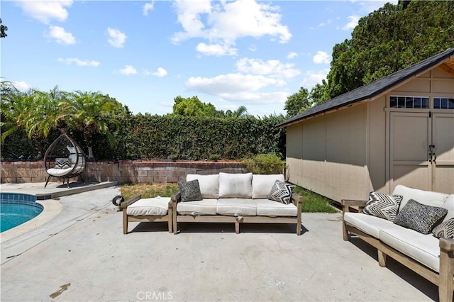 view of patio with a shed and an outdoor living space