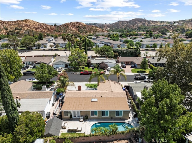 birds eye view of property with a mountain view