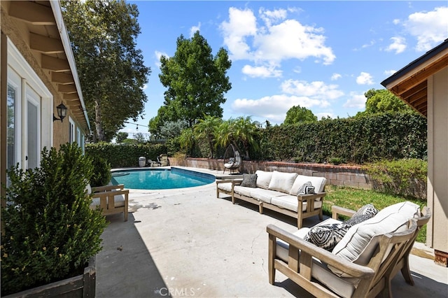 view of swimming pool with outdoor lounge area and a patio area