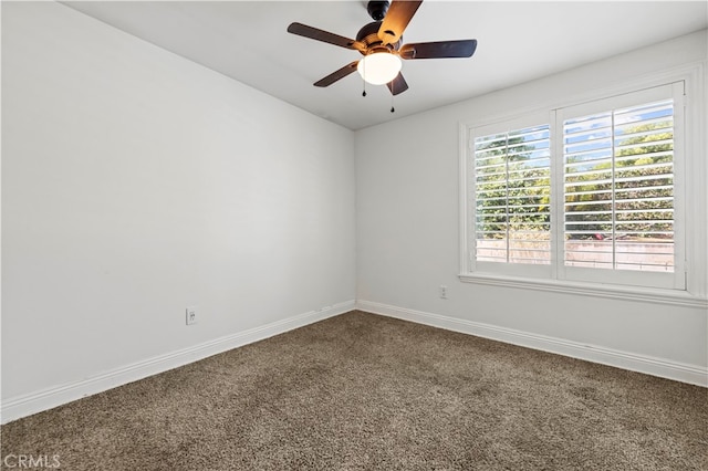 spare room with ceiling fan and carpet flooring