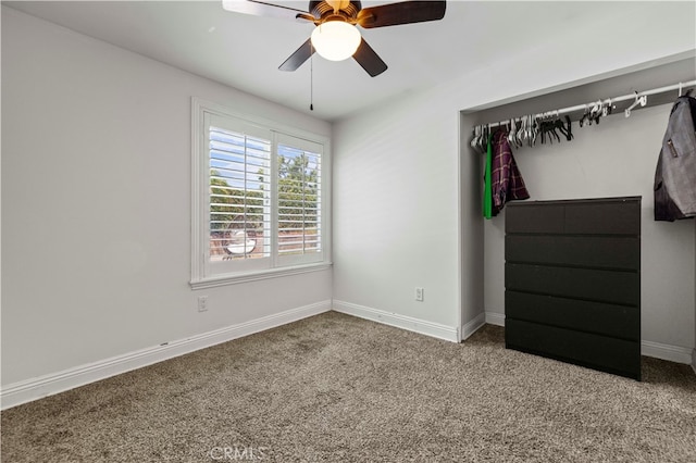 unfurnished bedroom featuring a closet, carpet, and ceiling fan