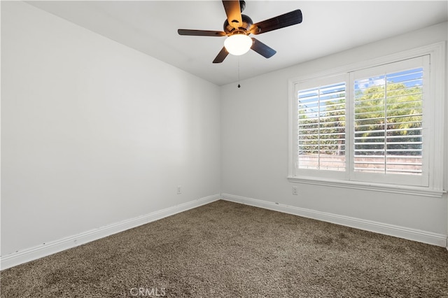 spare room featuring carpet and ceiling fan