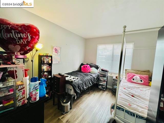 bedroom with wood-type flooring