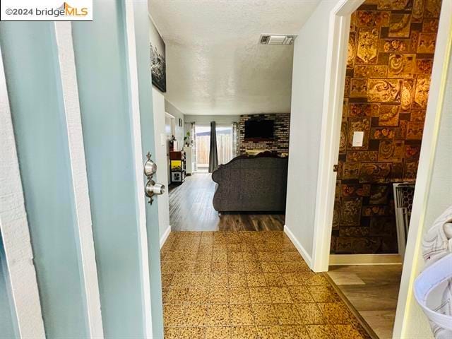 hallway with wood-type flooring