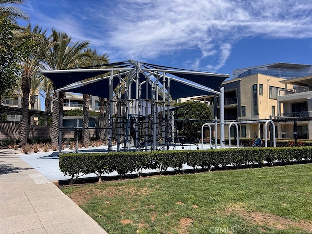 exterior space with a lawn and a balcony