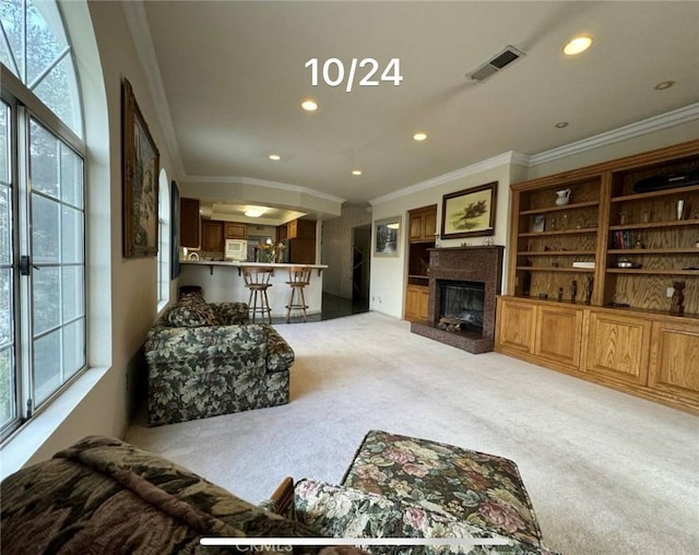 carpeted living room featuring crown molding and plenty of natural light