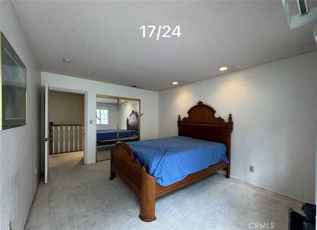 carpeted bedroom with a closet