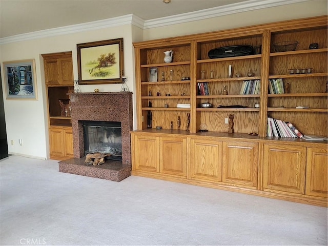 living room featuring a high end fireplace, light colored carpet, and crown molding