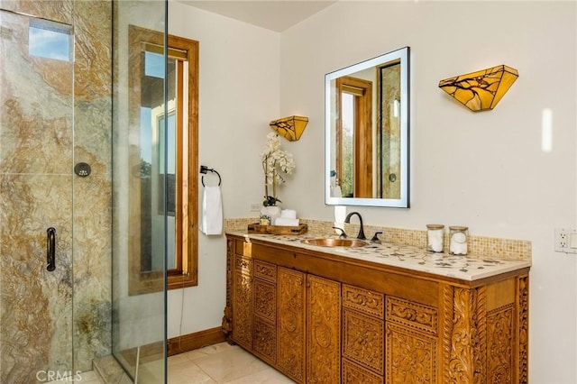 bathroom featuring a shower with door, vanity, and tile patterned flooring