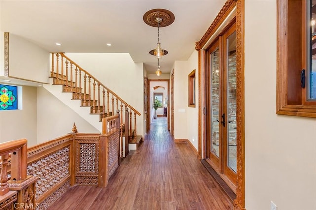 foyer featuring dark wood-type flooring and french doors