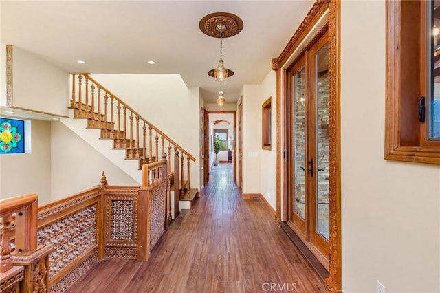 hall featuring stairway, recessed lighting, french doors, baseboards, and wood finished floors