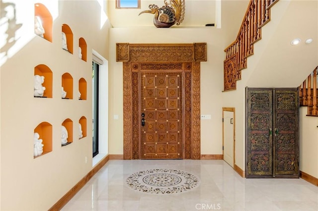 corridor featuring a high ceiling