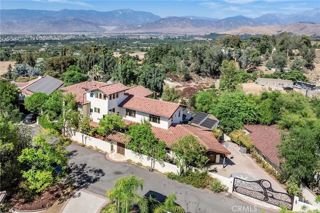 birds eye view of property with a mountain view