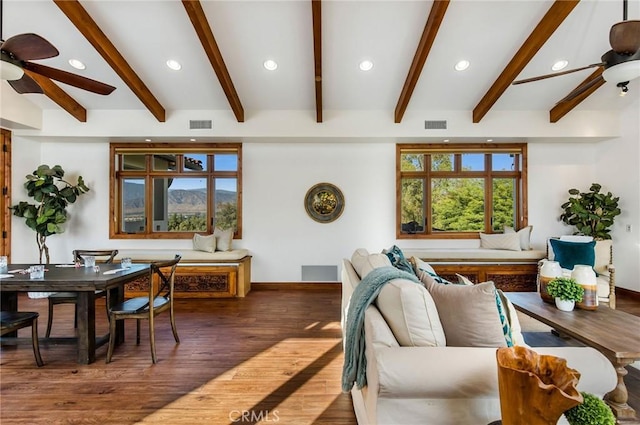 living room featuring dark hardwood / wood-style floors and beam ceiling