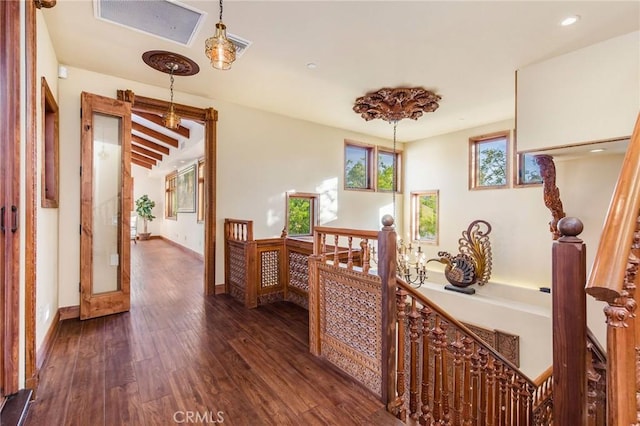 corridor with dark hardwood / wood-style flooring