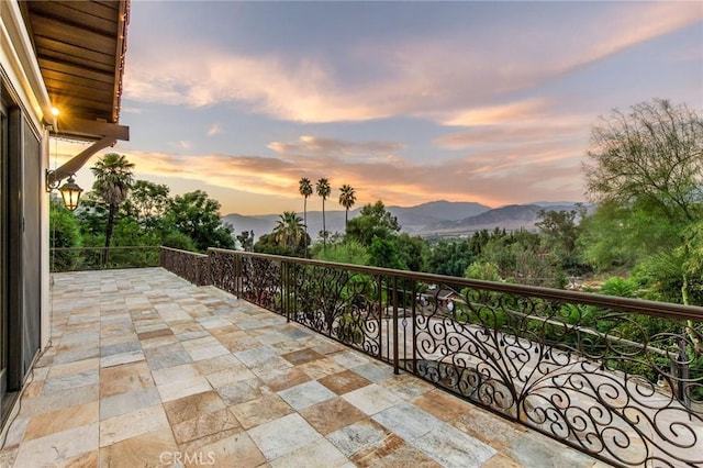 balcony at dusk with a mountain view