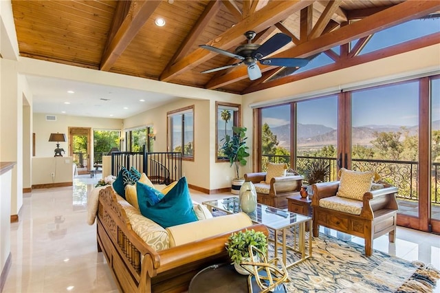 sunroom featuring wood ceiling, french doors, ceiling fan, lofted ceiling with beams, and a mountain view