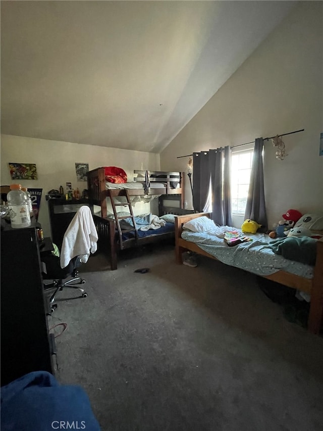 bedroom with carpet flooring and vaulted ceiling