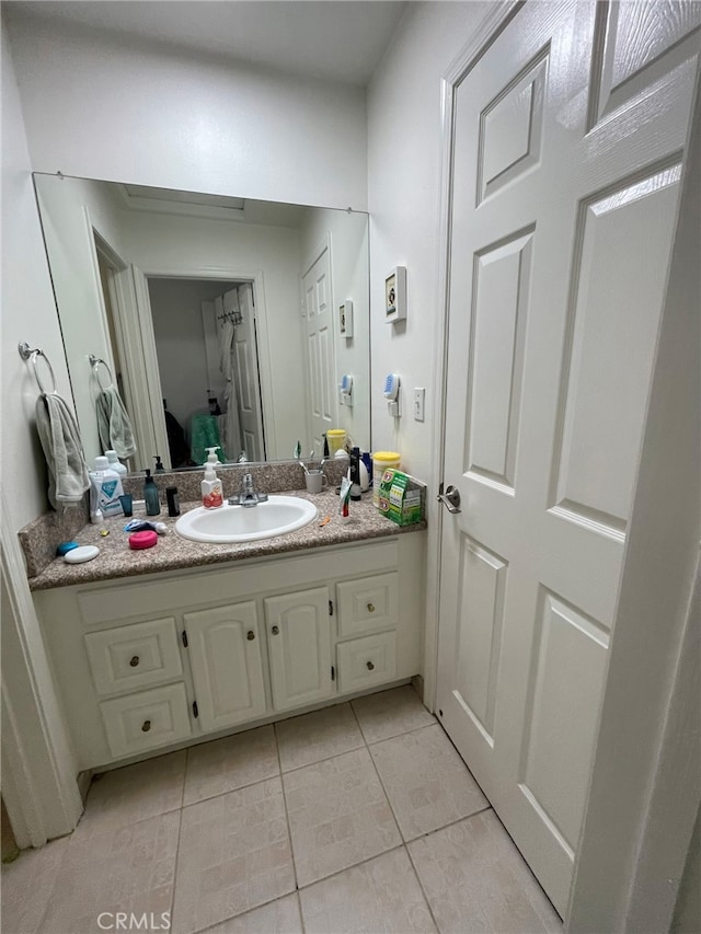 bathroom featuring vanity and tile patterned flooring