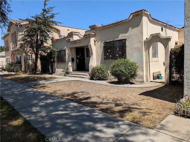mediterranean / spanish house with stucco siding
