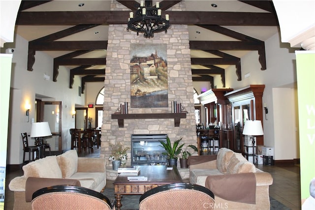 living room with a fireplace, beamed ceiling, and high vaulted ceiling