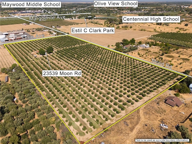 birds eye view of property with a rural view