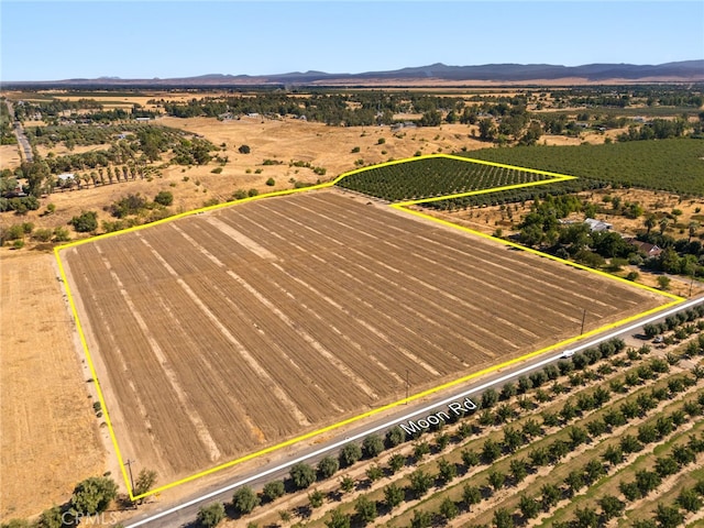 drone / aerial view with a mountain view and a rural view