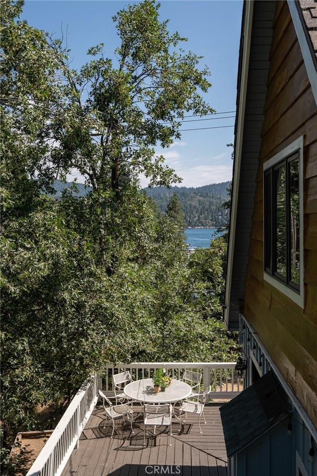 wooden deck featuring a water view