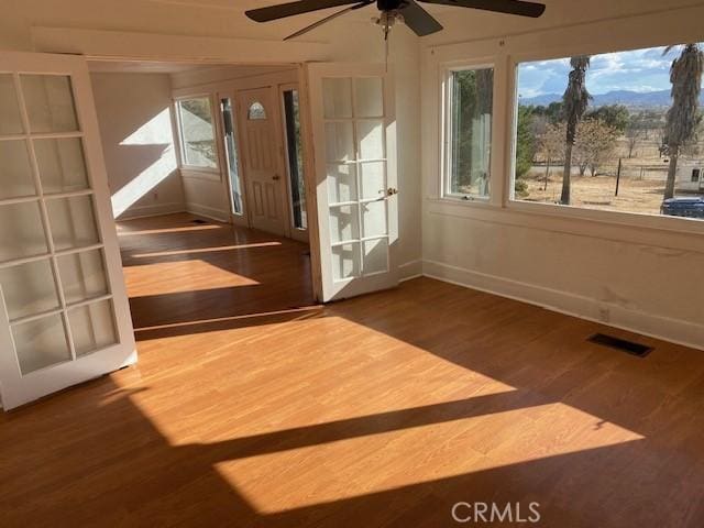 unfurnished sunroom featuring french doors