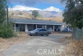 view of parking / parking lot with a mountain view