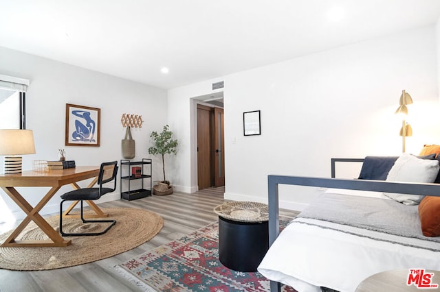 bedroom with light hardwood / wood-style flooring