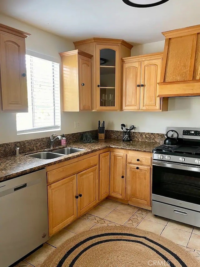 kitchen featuring stainless steel appliances, light tile patterned flooring, custom range hood, and sink