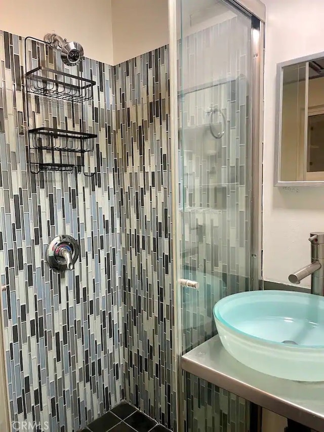 bathroom featuring tile patterned flooring and sink