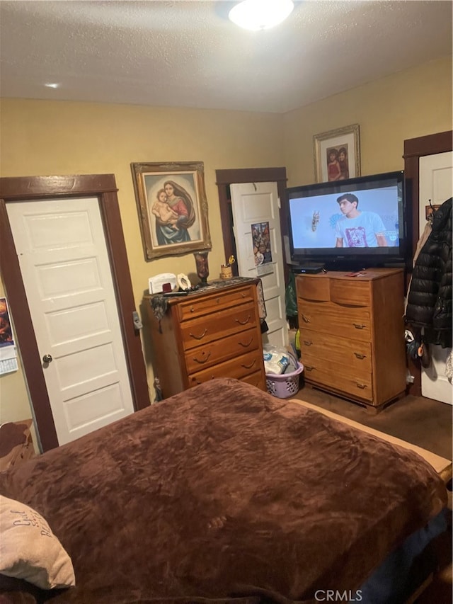 bedroom featuring a textured ceiling