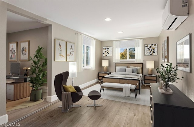 bedroom with light wood-style floors, recessed lighting, a wall unit AC, and baseboards