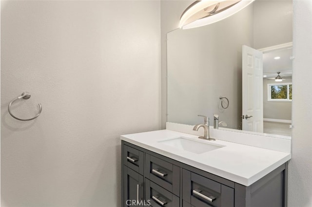 bathroom featuring ceiling fan and vanity