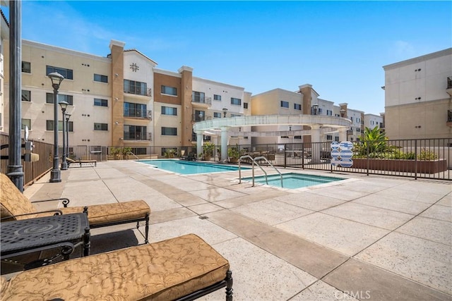 view of swimming pool with a patio