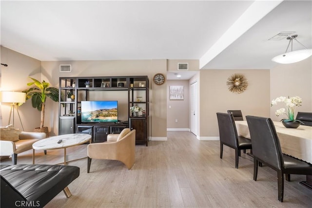 living room with light hardwood / wood-style floors