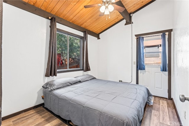 bedroom with vaulted ceiling with beams, wood ceiling, ceiling fan, and light hardwood / wood-style flooring