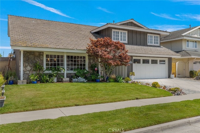 view of front of home featuring a garage and a front lawn