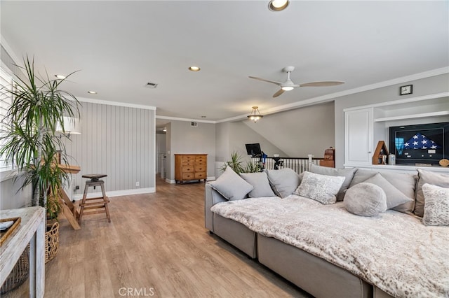 bedroom featuring light wood-type flooring, ceiling fan, and ornamental molding