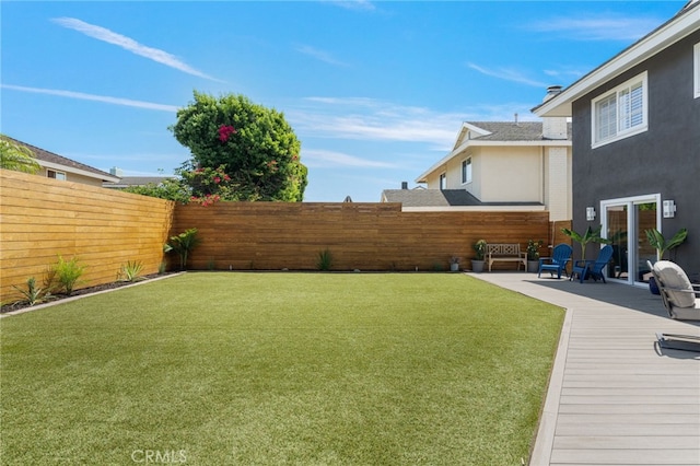 view of yard with a deck