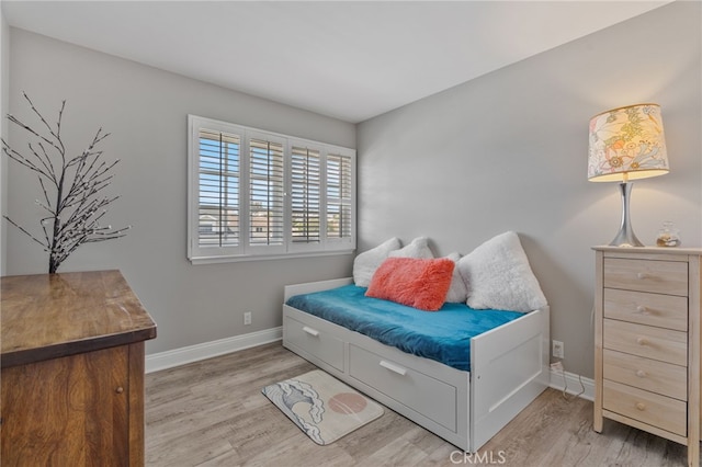 bedroom with light hardwood / wood-style floors