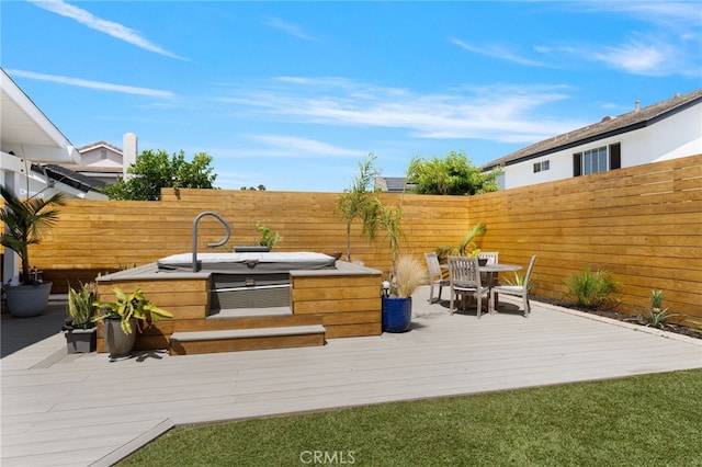 view of patio / terrace featuring a wooden deck and area for grilling