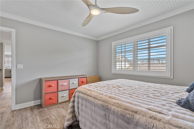 bedroom featuring ceiling fan, light hardwood / wood-style flooring, and crown molding